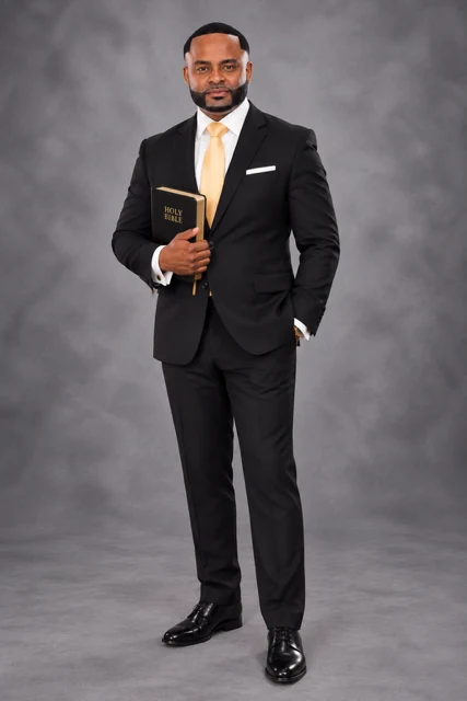 Rev. Dr. Michael T. Robinson holding a Bible